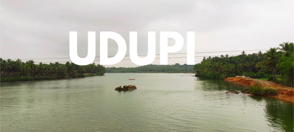 Serene Malpe Beach backwaters in Udupi, Karnataka with calm turquoise waters and coastal landscape