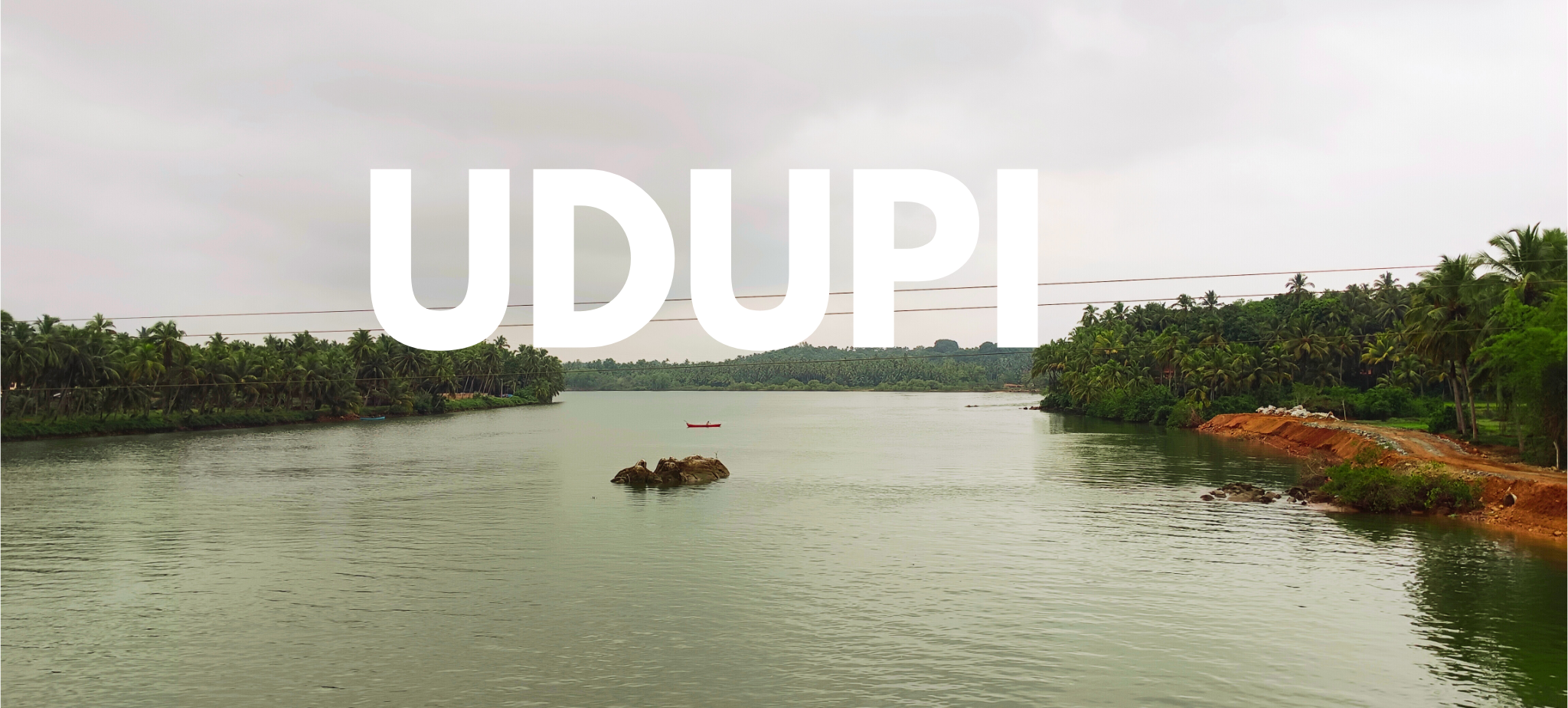 Serene Malpe Beach backwaters in Udupi, Karnataka with calm turquoise waters and coastal landscape