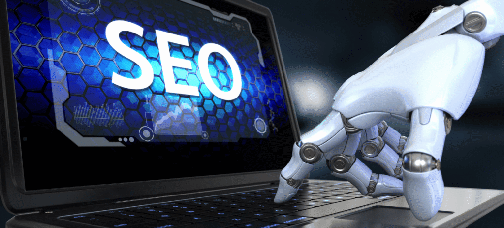 Robot hand typing on a laptop showing SEO – free AI SEO agent for bloggers
